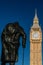 Big Ben and a staue of Winston Churchill in Parliament Square, Westminster, London, England