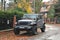 Big black high 4x4 offroad car Jeep Wrangler Sahara five door parked