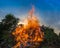 Big bonfire against blue sky