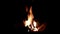 Big bonfire, night. A huge fire on a dark background. Campfire close-up.