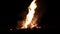 Big bonfire, night. A huge fire on a dark background.The sound of fir.Huge bonfire. Accelerated video.