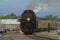 Big Boy 4014 with Smoke and Steam steaming out of Ellsworth Kansas USA on a summer day.