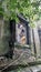 Big Buddha sculpture under canvas roof in sunken temple