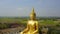 Big Buddha of Thailand, Aerial scene from sky Drone fly slide right