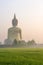 The Big Buddha at Wat Muang Temple with fog