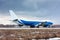 Big cargo plane moves on the runway at a cold winter airport