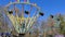 Big Carousel Spinning Around In Park