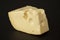 Big chunk of Swiss Emmental cheese isolated on black
