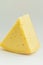 Big Chunk Wedge of Alpine Creamy Appetizing Light Yellow Tilsit Cheese on White Background. Texture with Cracks and Holes