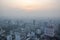 Big city in misty smoke at sunset, Bangkok, Thailand