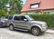 Big classic silver grey British 4WD car Landrover Discovery LR3 third generation right side and front view