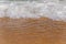 Big close foam wave on sea close with beach