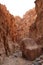 Big colorful, striped rock in the Whadi Ghuweir Canyon, Dana, Jordan