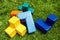 Big colorful tetris cubes on green grass. Outdoor team building games