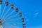 Big colourful ferris wheel in amusement park