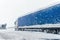 Big commercial semi-trailer truck trapped in snow drift on closed highway road at heavy snow storm blizzard cold winter