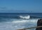 BIg crushing white wave over the Atlantic Ocean seen from terrace at la Fajana, La Palma, Canary Islands, Spain. Blue