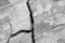 Big deep branched crack on wall with old plaster, abstract image of diagonal cleft. Close-up. Horizontal photo. Copy space.