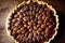 Big delicious pecan pie tart with nuts on table