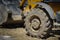 Big dirty wheel of a heavy industrial truck, bulldozer