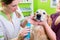 Big dog getting dental care by woman at dog parlor