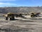 Big dump trucks view on coal mine area