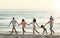 Big family, walking and holding hands at beach at sunset, having fun and bonding on vacation outdoors. Care, mockup and
