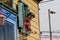 Big fibreglass figurine of a woman welcoming tourist from her window on the first floor at La Boca, Buenos Aires,  Argentina