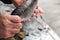 big fish in the hands of the fisherman. old male hands. close-up