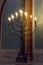 Big floor menorah in church. Traditional menorah with candles. Big candlestick with lights. Religion and faith concept.