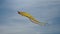 Big Flying yellow Kite on blue background