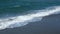 Big foamy waves crashing on the beach. Seaside on a windy day. Storm