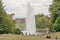 The big fountain. People on a hillside admire the fountain in Karlsaue park in Kassel, Germany