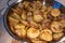 Big frying pan filled with hot just baked western country potatoes. Concept of traditional home made cuisine