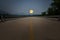 Big full moon over concrete bridge