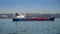 Big gas tanker or cargo ship in the sea harbour on sunny day