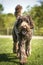 Big Giant Brown Labradoodle walking directly towards the camera