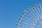 Big giants funfair ferris wheel against blue sky