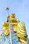 Big golden Bodhisattva statue with blue sky
