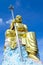 Big golden Bodhisattva statue with blue sky