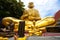 Big golden monk statue