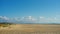 Big golden sand beach at sunny day. Minimalist coastal panorama of a large empty beach