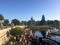 A big group of tourists hanging out on the waterfront along Government Street with the British Columbia Parliament Buildings