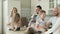 Big happy Caucasian family of three generations gathered together in kitchen