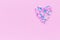 Big heart consists from many small hearts on pink background with copy space for text or congratulations. Love or holiday concept