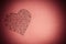 Big heart made up of small hearts. Drawing black pen on a pink background. Place for text. Postcard. Valentine`s Day