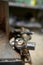 Big heavy anvil and hammer in the blacksmith`s workshop, close-up, shallow depth of field, vertical.