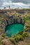 The Big Hole in Kimberley, a result of the mining industry, with the town skyline on the edge