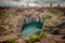 The Big Hole in Kimberley, a result of the mining industry, with the town skyline on the edge