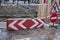 Big hole in road made for road repairing works with caution sign